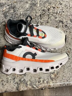 On Running Cloudtec cloudmonster Sneakers in White, Orange & black